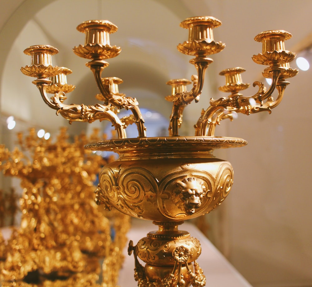 closeup photo of gold metal candle holder