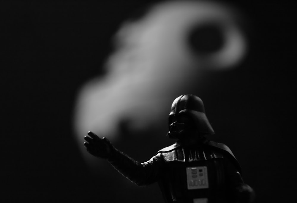 grayscale photo of Star Wars Darth Vader action figure