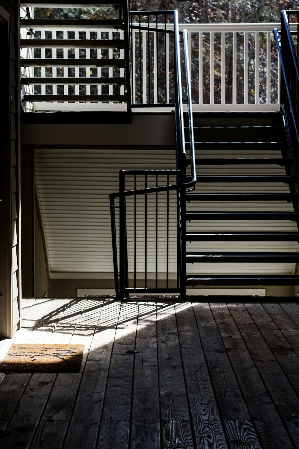 a set of stairs leading up to a balcony