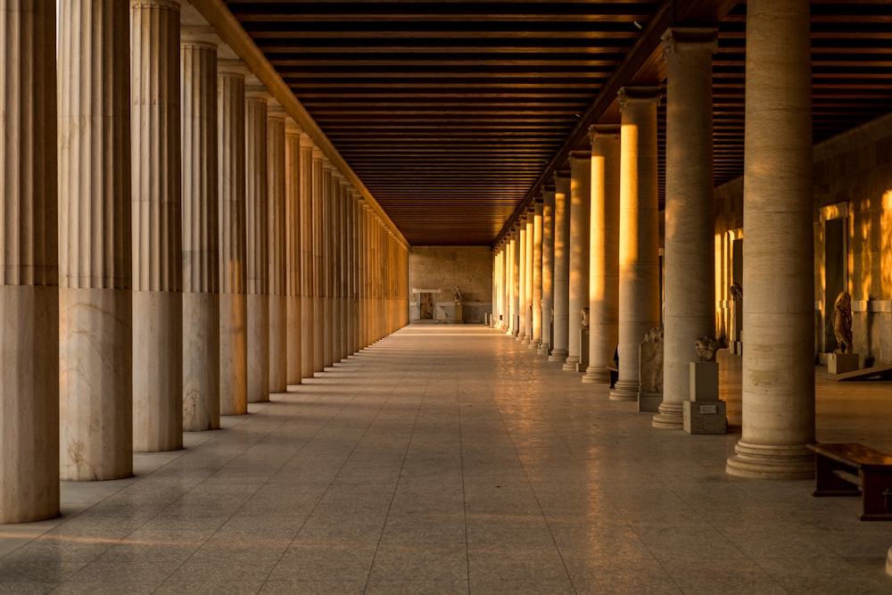 photo of brown and black concrete columns inside building interior