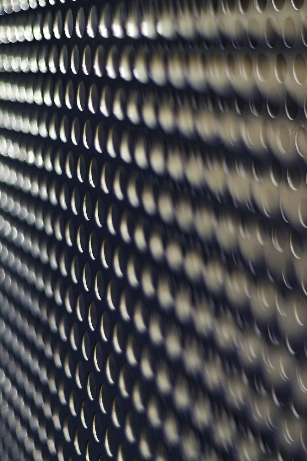 a close up of a wall made of circles