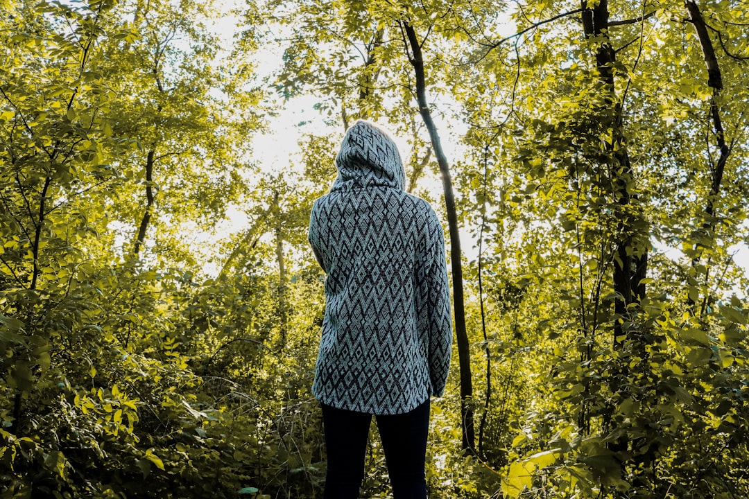 person standing near trees