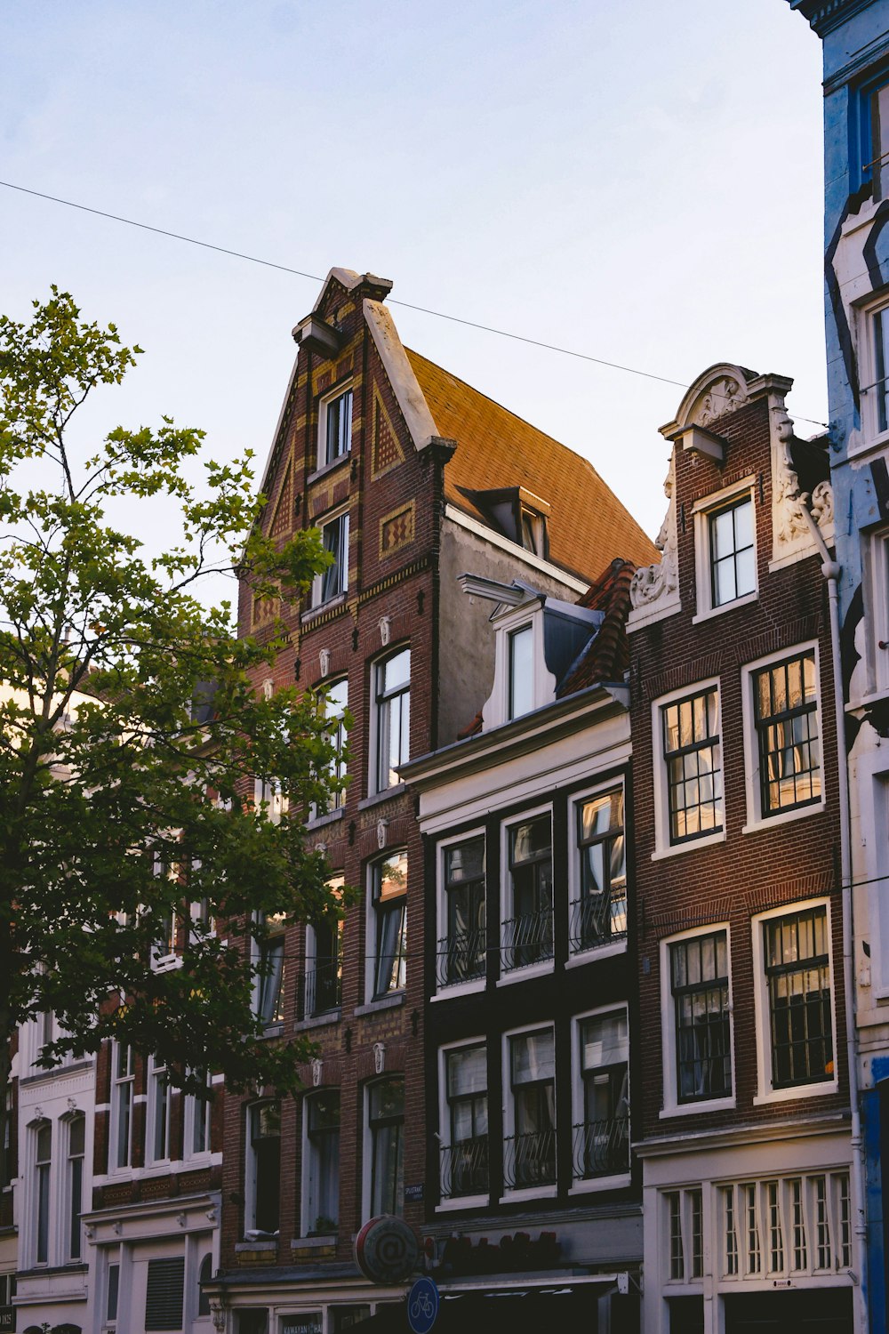 white and brown houses under white sky