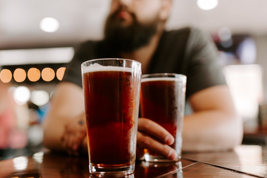 two full clear drinking glasses, Summit Beer