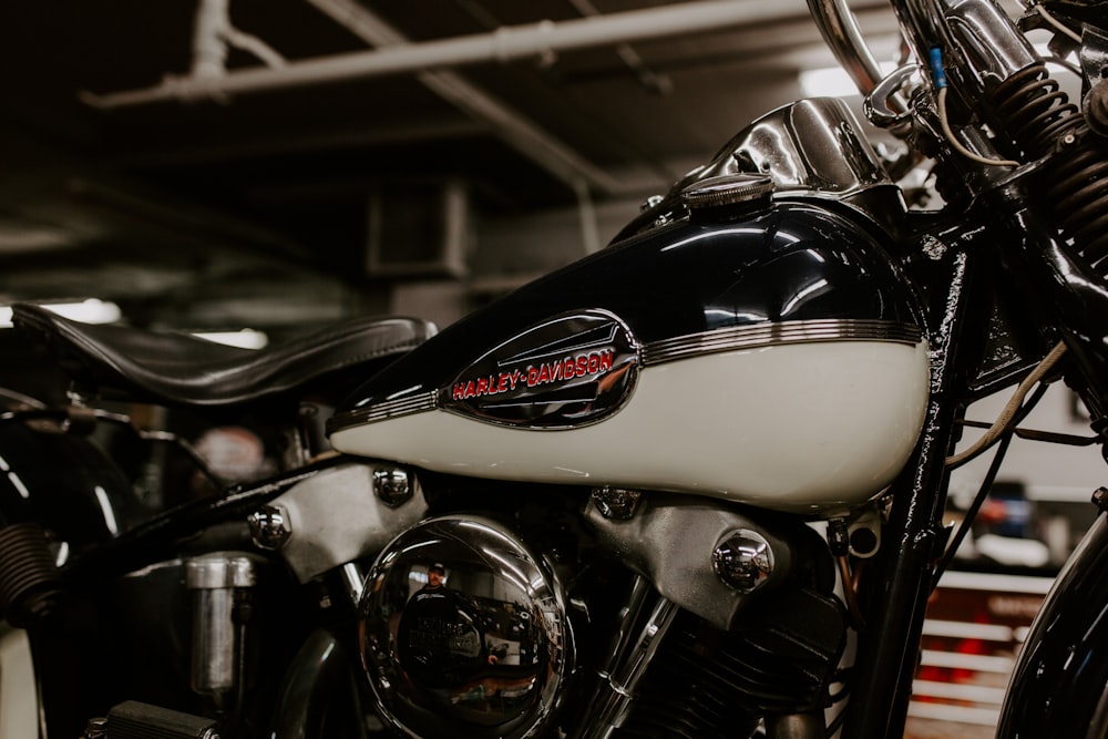 a black and white motorcycle parked in a garage