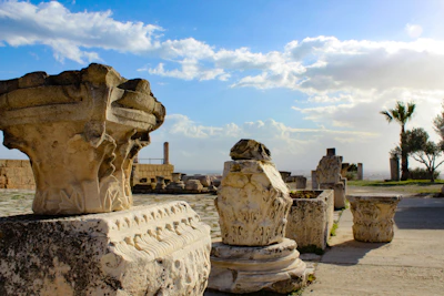 Venturer Scouts exploring ancient ruins in Turkiye, sunlight casting long shadows on the stone.