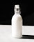 clear glass bottle filled with white liquid