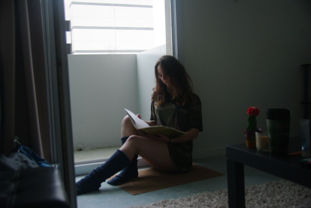 sitting woman leaning on an open door