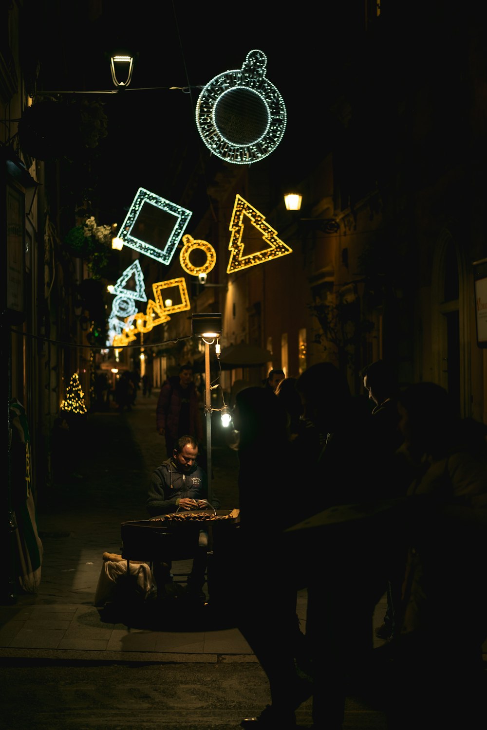 people near buildings during night