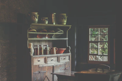 Rustic kitchen cabinets made from reclaimed wood with visible knots and textures.