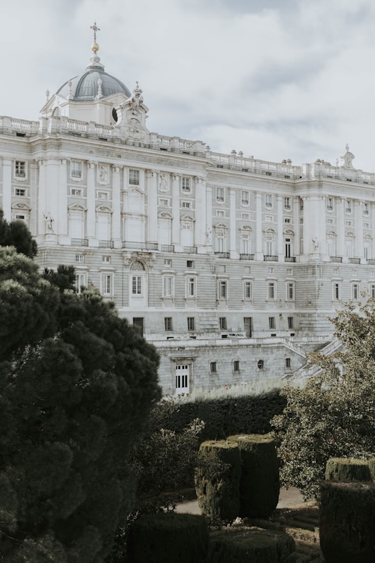 white and gray dome church during daytime in Royal Palace of Madrid Spain