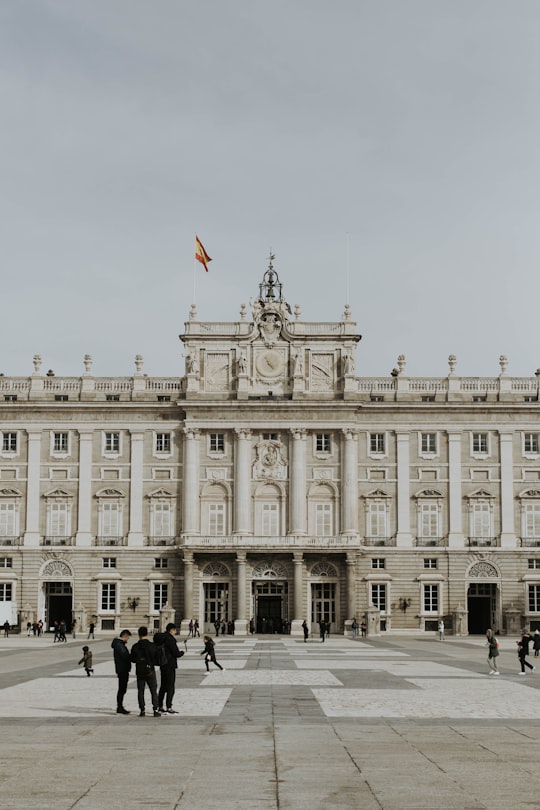 people walking near Royal Palace of Madrid in Royal Palace of Madrid Spain