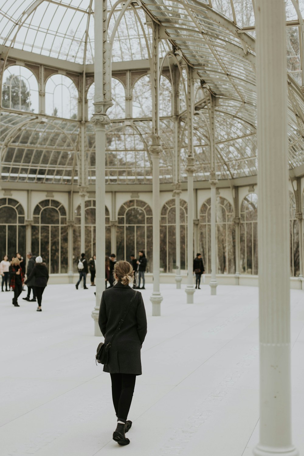 people walking inside dome building