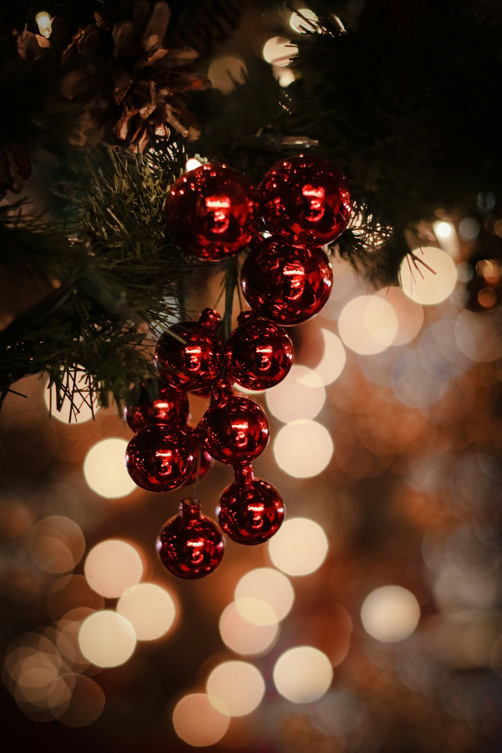 macro photography of red Christmas baubles