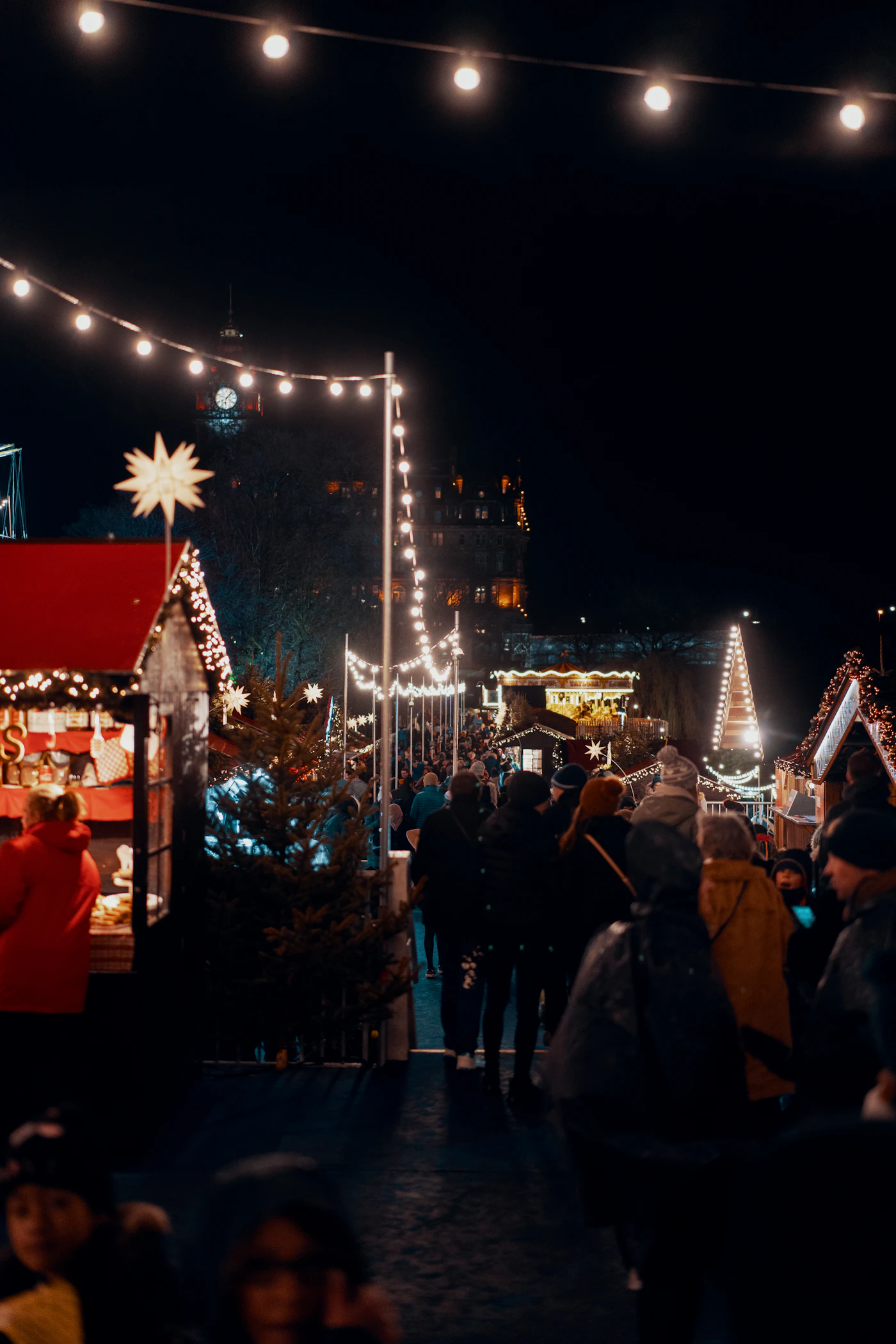 String lights over an evening Christmas market
