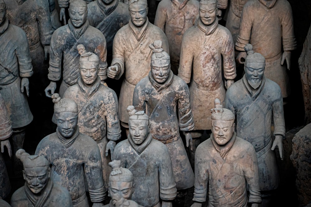 selective focus photography of Terracotta warriors statue lot