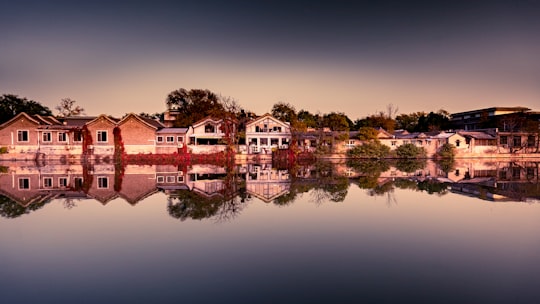 brown and white houses near body of water in Beijing China