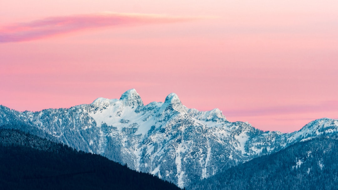 snow covered mountain during golden hour