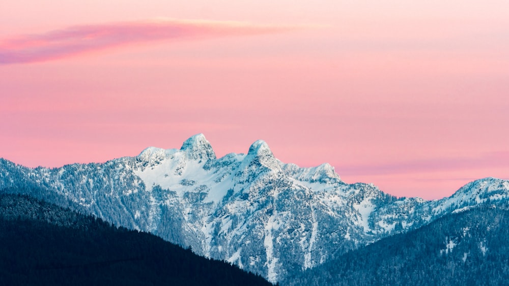 snow covered mountain during golden hour