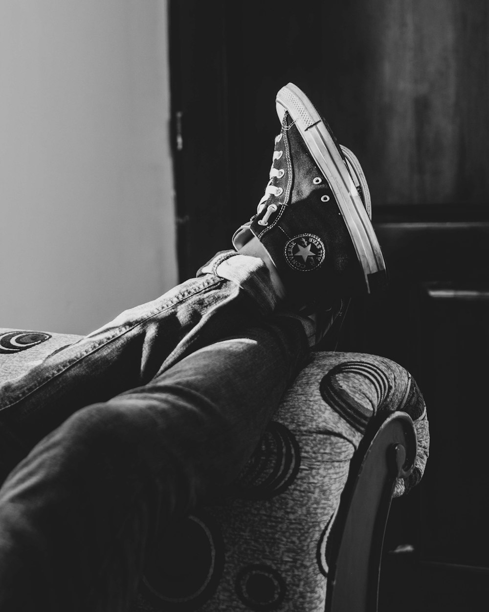 grayscale photography of Converse All-Star sneakers