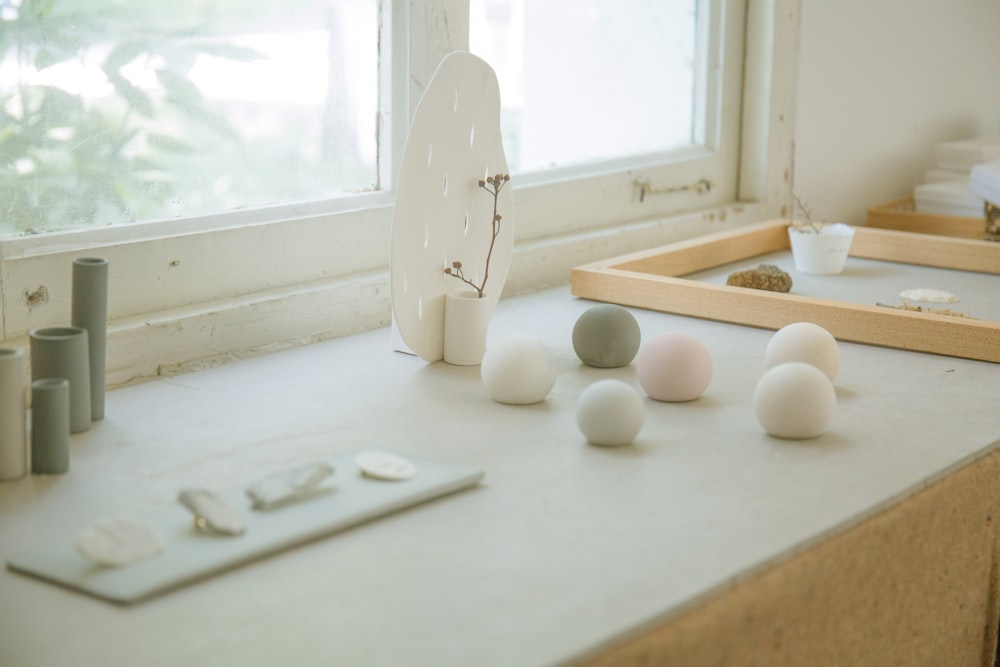 bath bombs on table top by window during daytime