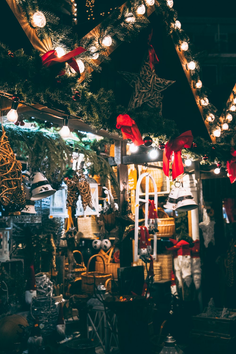 string lights on house with assorted items displayed outside