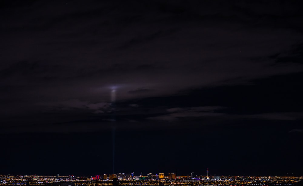 white light raised to clouds at nighttime