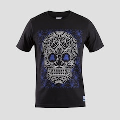 A black T-shirt features an intricate skull design with floral and geometric patterns in white and blue. The skull is stylized with ornate details highlighting the eyes, nose, and mouth, creating a visually striking effect against the dark fabric.