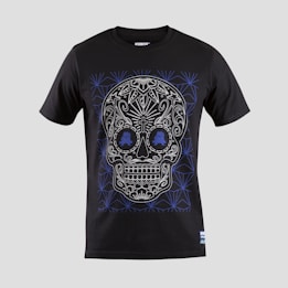 A black T-shirt features an intricate skull design with floral and geometric patterns in white and blue. The skull is stylized with ornate details highlighting the eyes, nose, and mouth, creating a visually striking effect against the dark fabric.