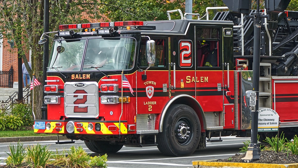 red and black firetruck near road