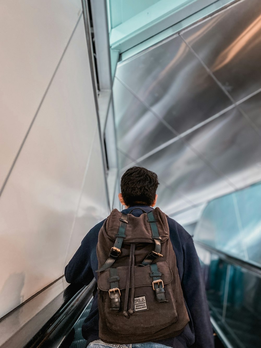 man brown leather backpack