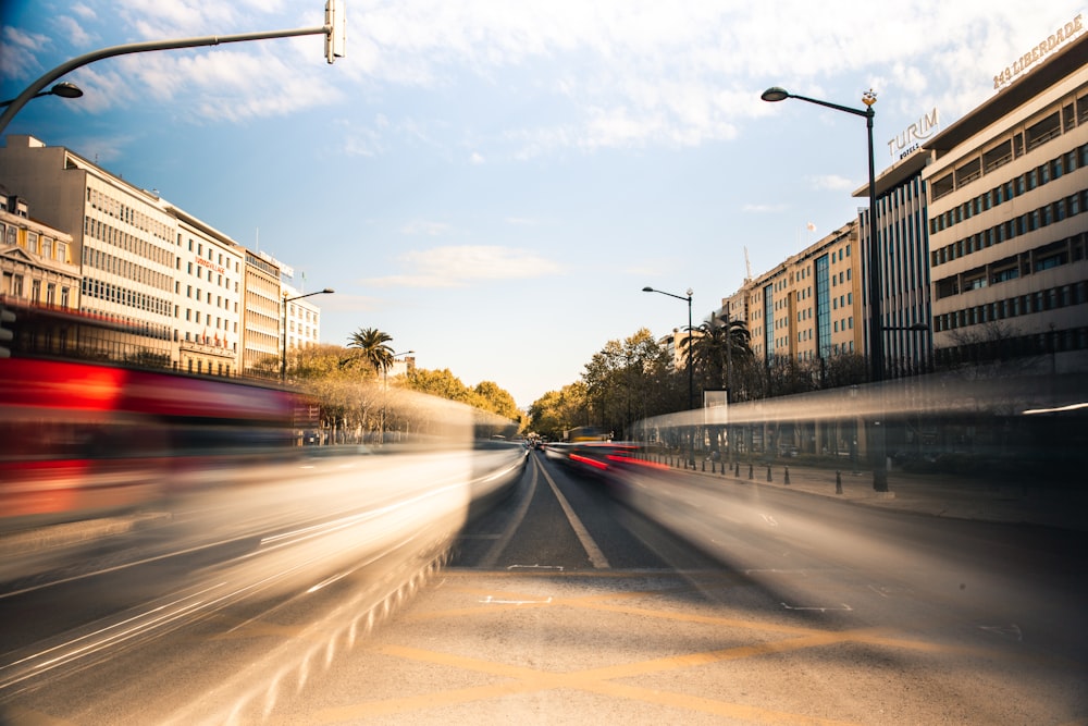 cars passing on road during daytime