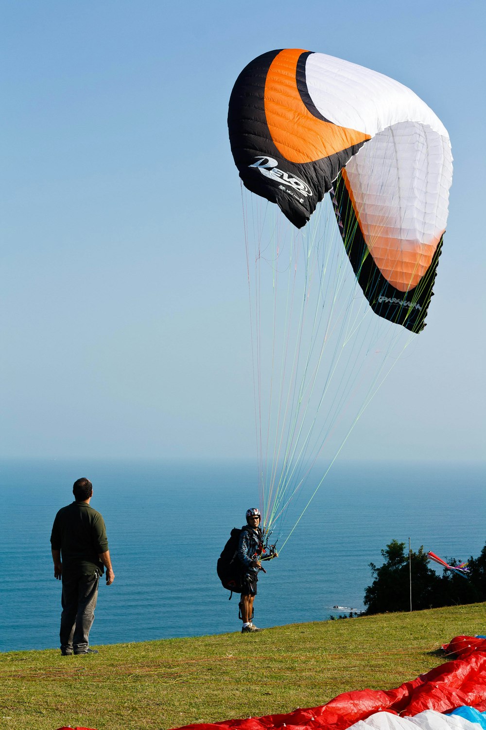 person standing while holding parachute