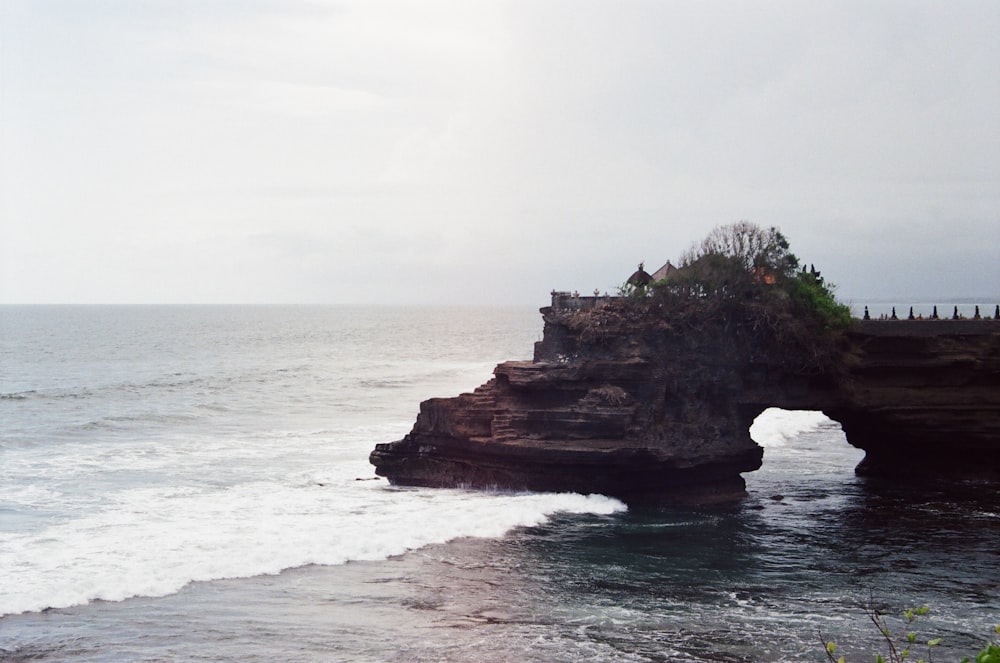 view photography of island in seashore