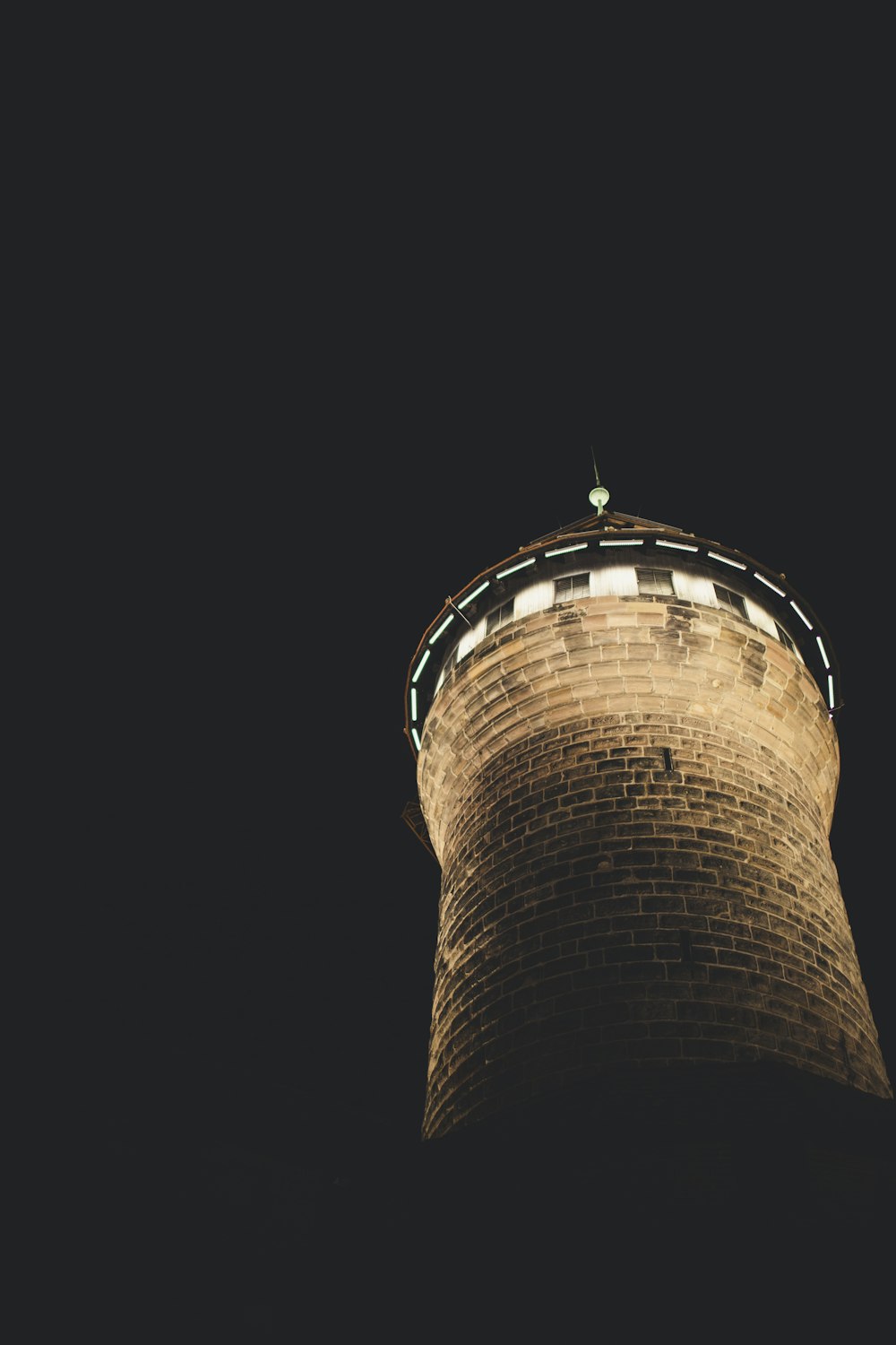 brown concrete tower during nighttime