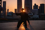 silhouette of man near buildings