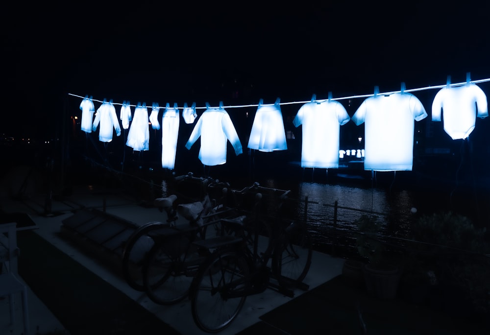 hanged white shirts at night