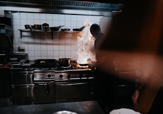 person doing cook inside kitchen