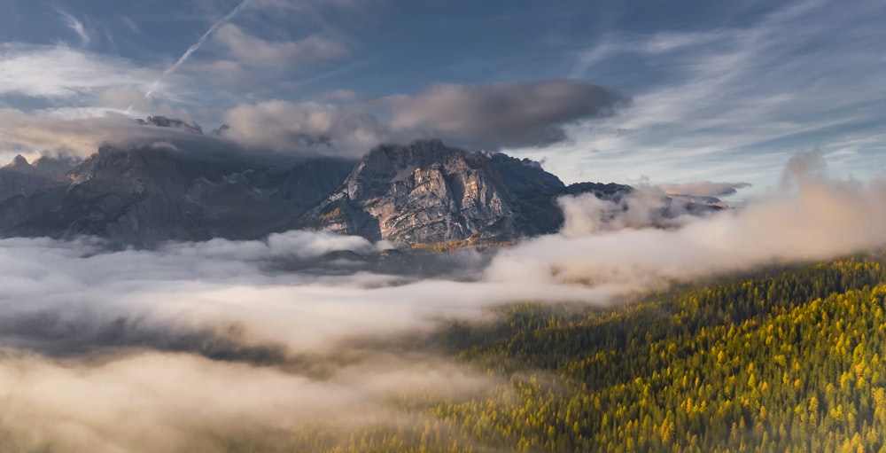 grey rocky mountain during cloudy day