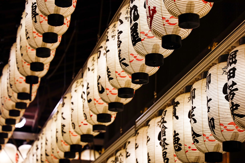 white Chinese lanterns hanging from the ceiling