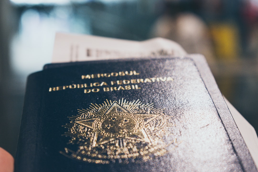 A traveller holding their passport and documents close, ready to check the dates