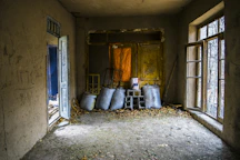 gray sacks on abandoned buidling