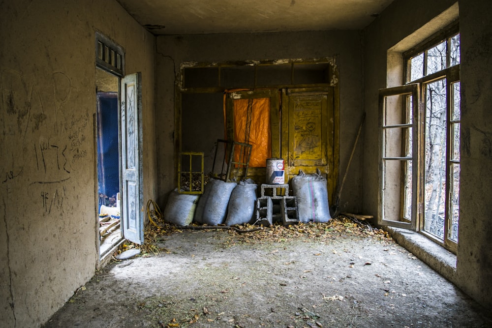 gray sacks on abandoned buidling