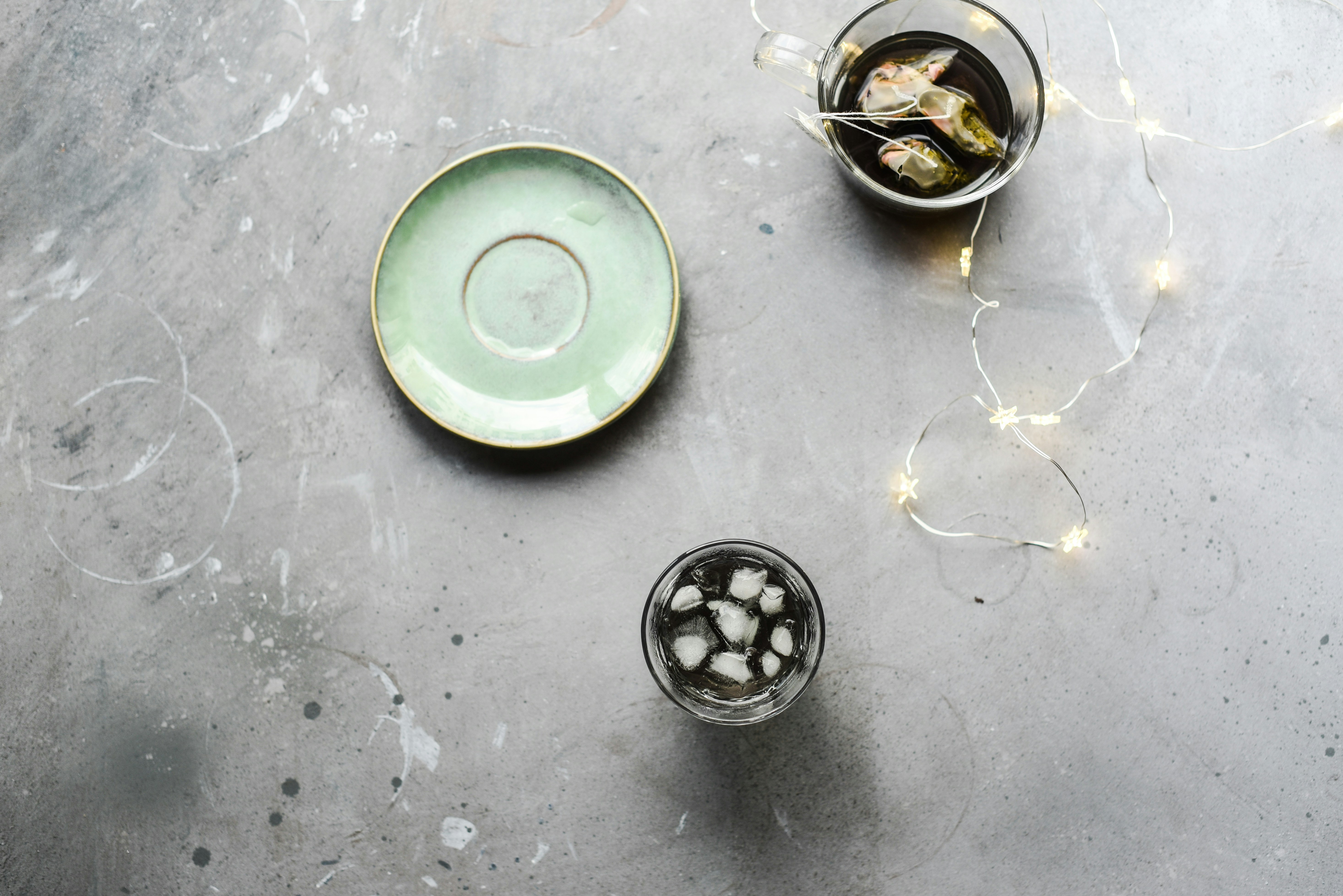white green saucer with drinking glass