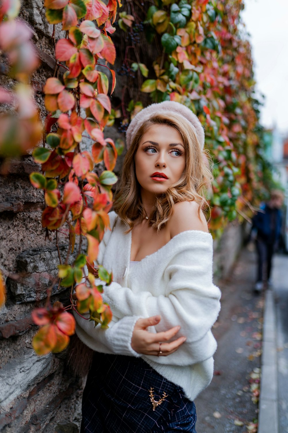 woman leaning on wall