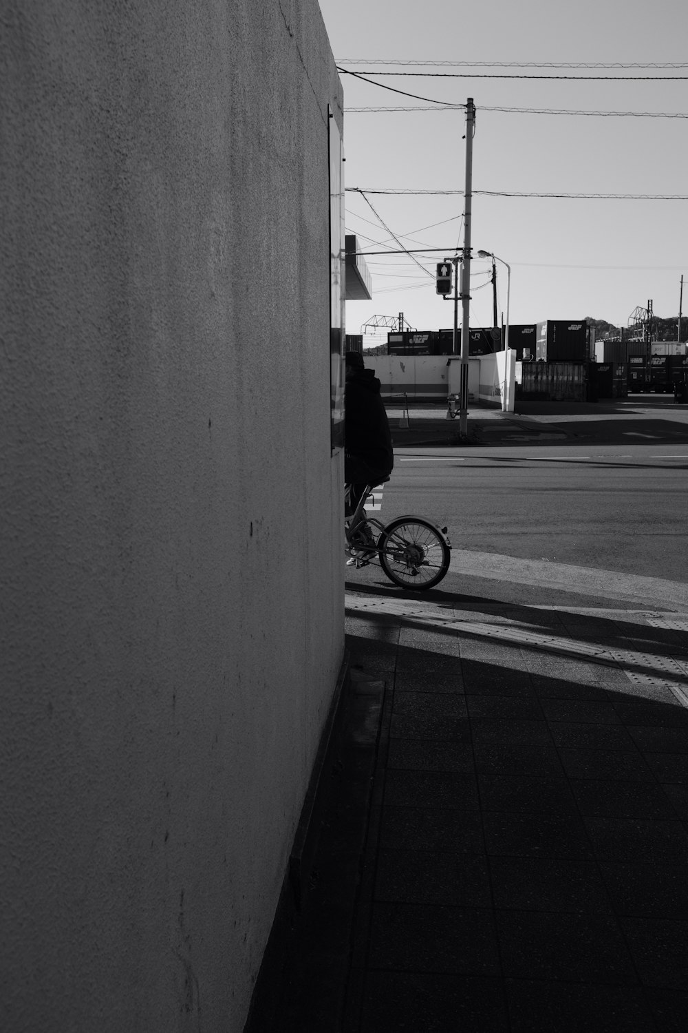grayscale photography of person biking on road