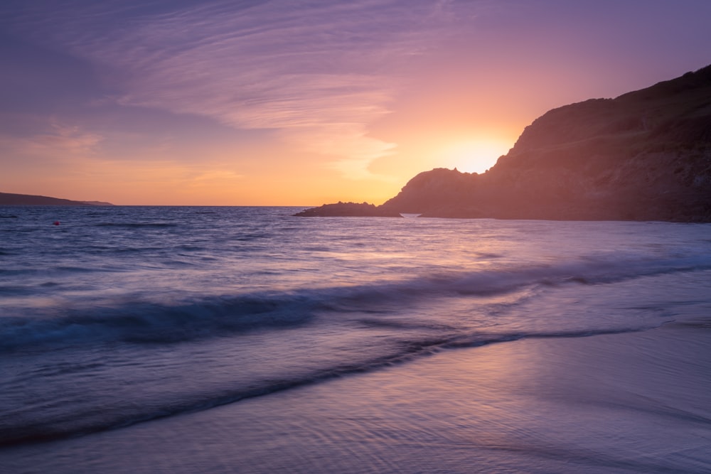 body of water during golden hour