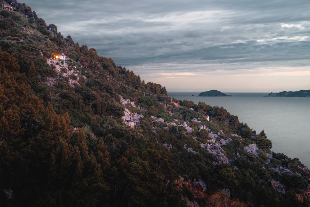 aerial photography mountain near sea during daytime