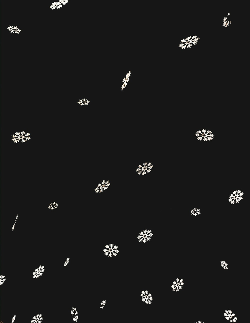 a black background with white flowers on it