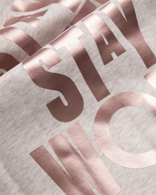 Bold typography design featuring a classic Texas phrase on a heather gray tee.